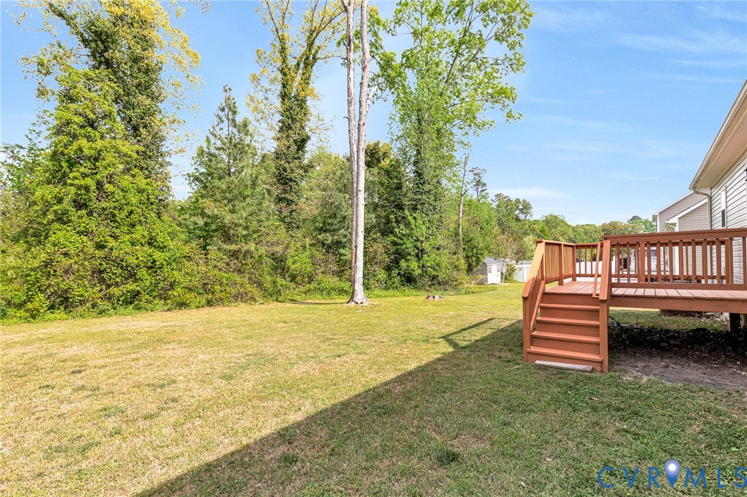 9925 Reymet Court Richmond, VA 23237 - Photo 27 of 30 a front view of a house with a garden