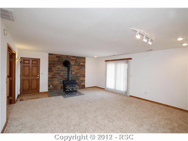 380 Struthers Loop Colorado Springs, CO 80921 - Photo 8 of 16 Living room of Mother-in-law suite on the lower level has a walk out to a patio