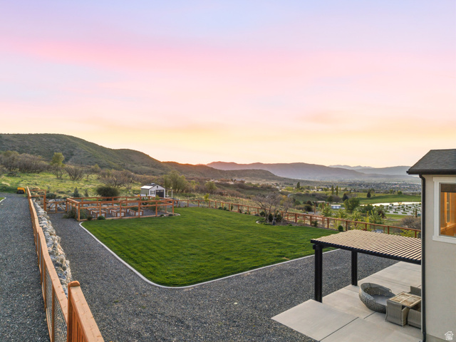 102 Elk Ridge Drive Elk Ridge, UT 84651 - Photo 53 of 61 Yard at dusk featuring a yard and a mountain view
