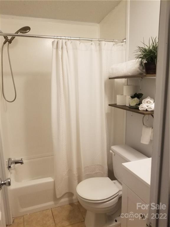 210 Baker Mill Road Cleveland, NC 27013 - Photo 3 of 13 a bathroom with a toilet and a shower