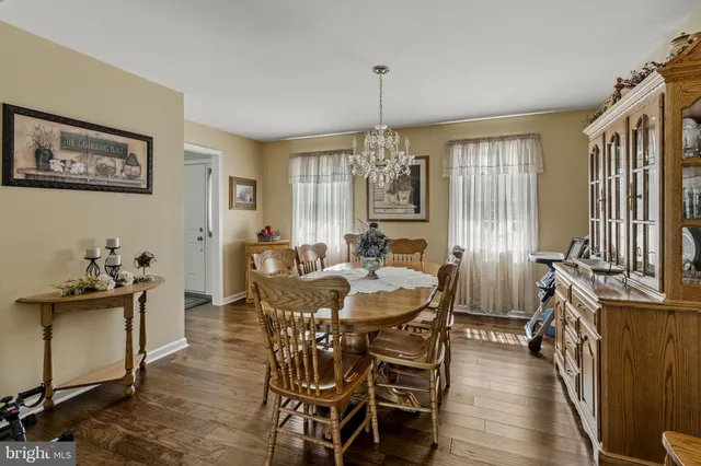 a kitchen with stainless steel appliances granite countertop a sink a stove and refrigerator