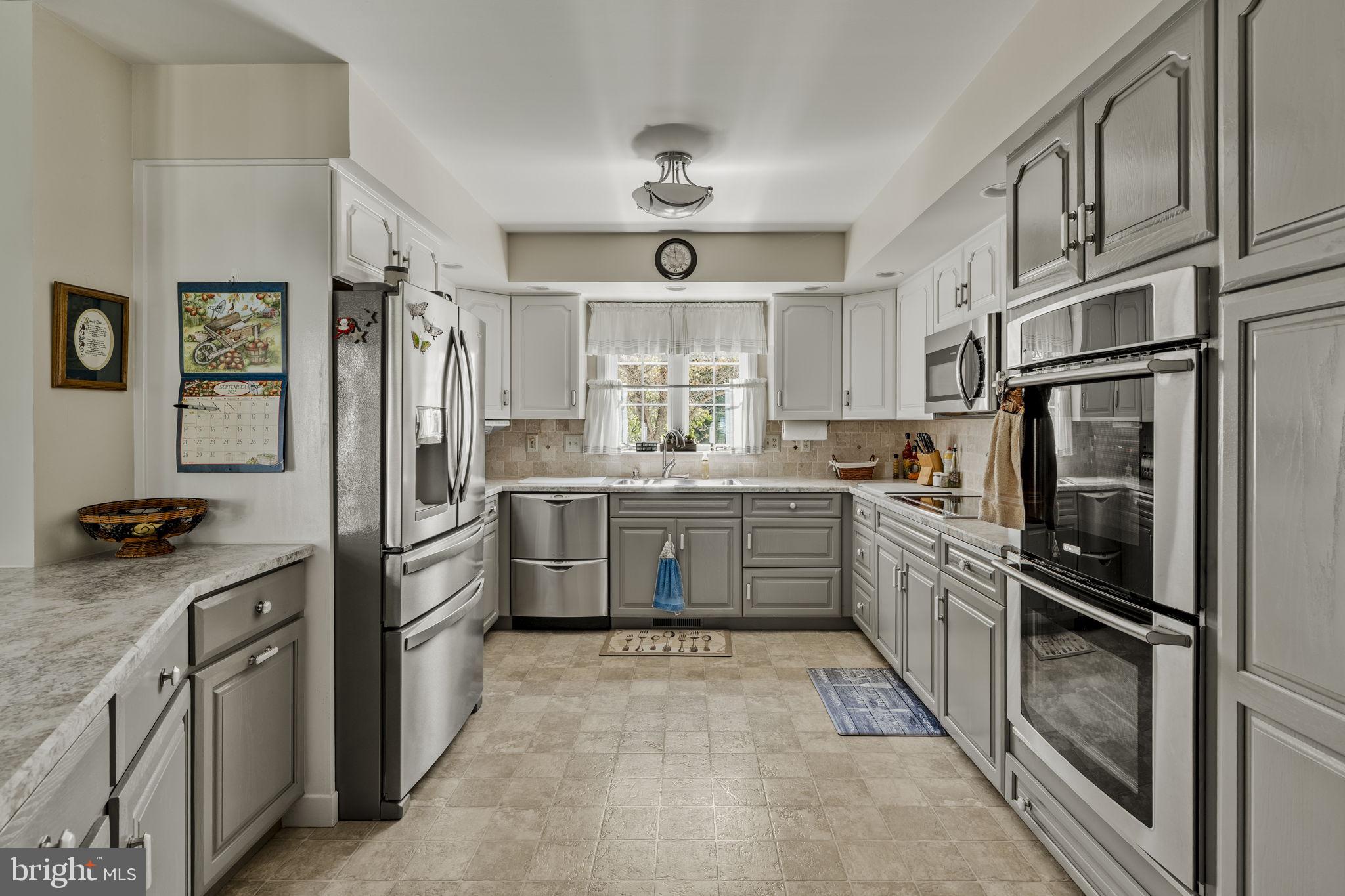 4 Eagle Circle Denver, PA 17517 - Photo 28 of 61 a kitchen with stainless steel appliances a refrigerator sink and cabinets
