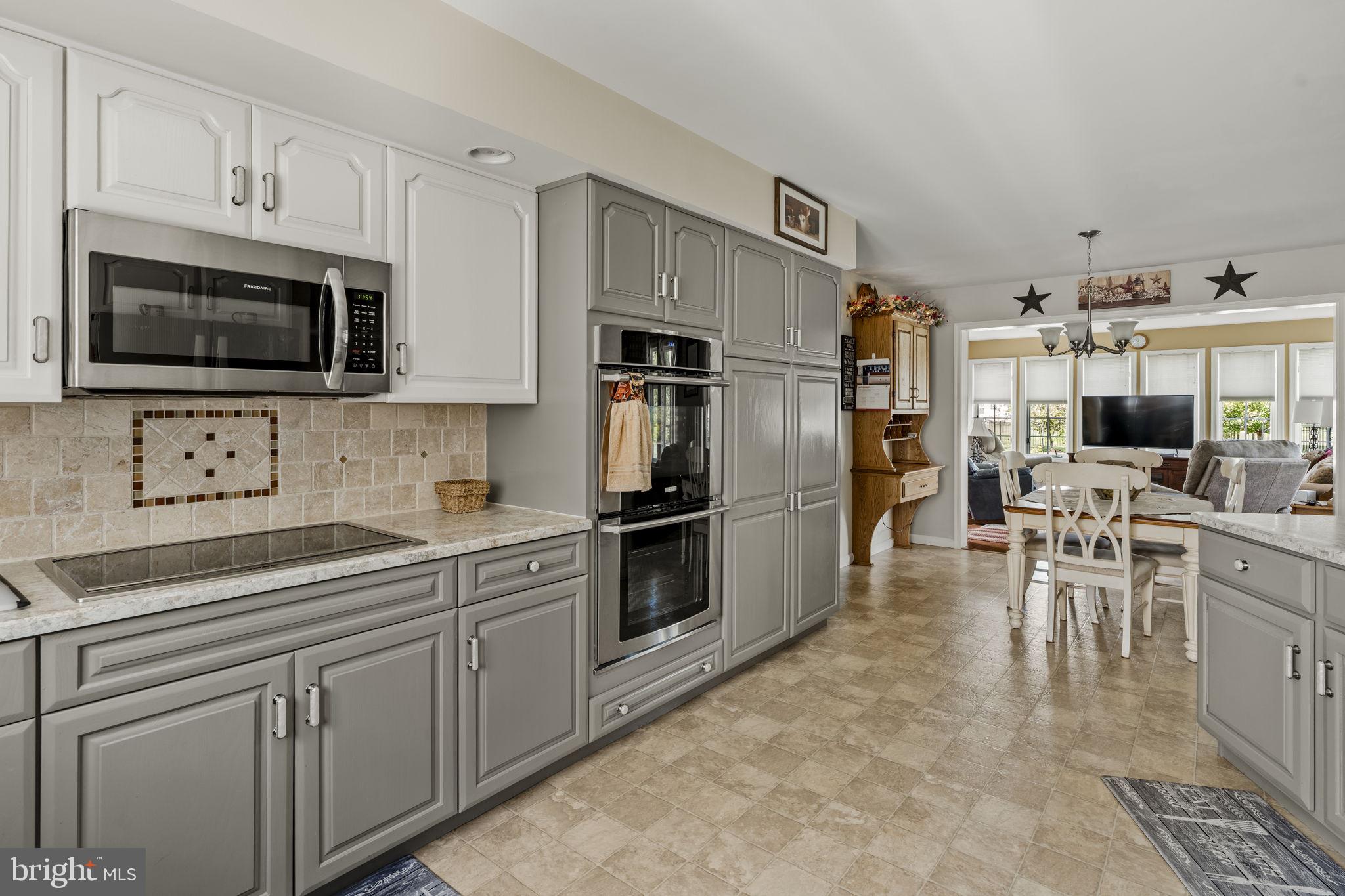 4 Eagle Circle Denver, PA 17517 - Photo 30 of 61 a kitchen with cabinets stainless steel appliances and a counter space