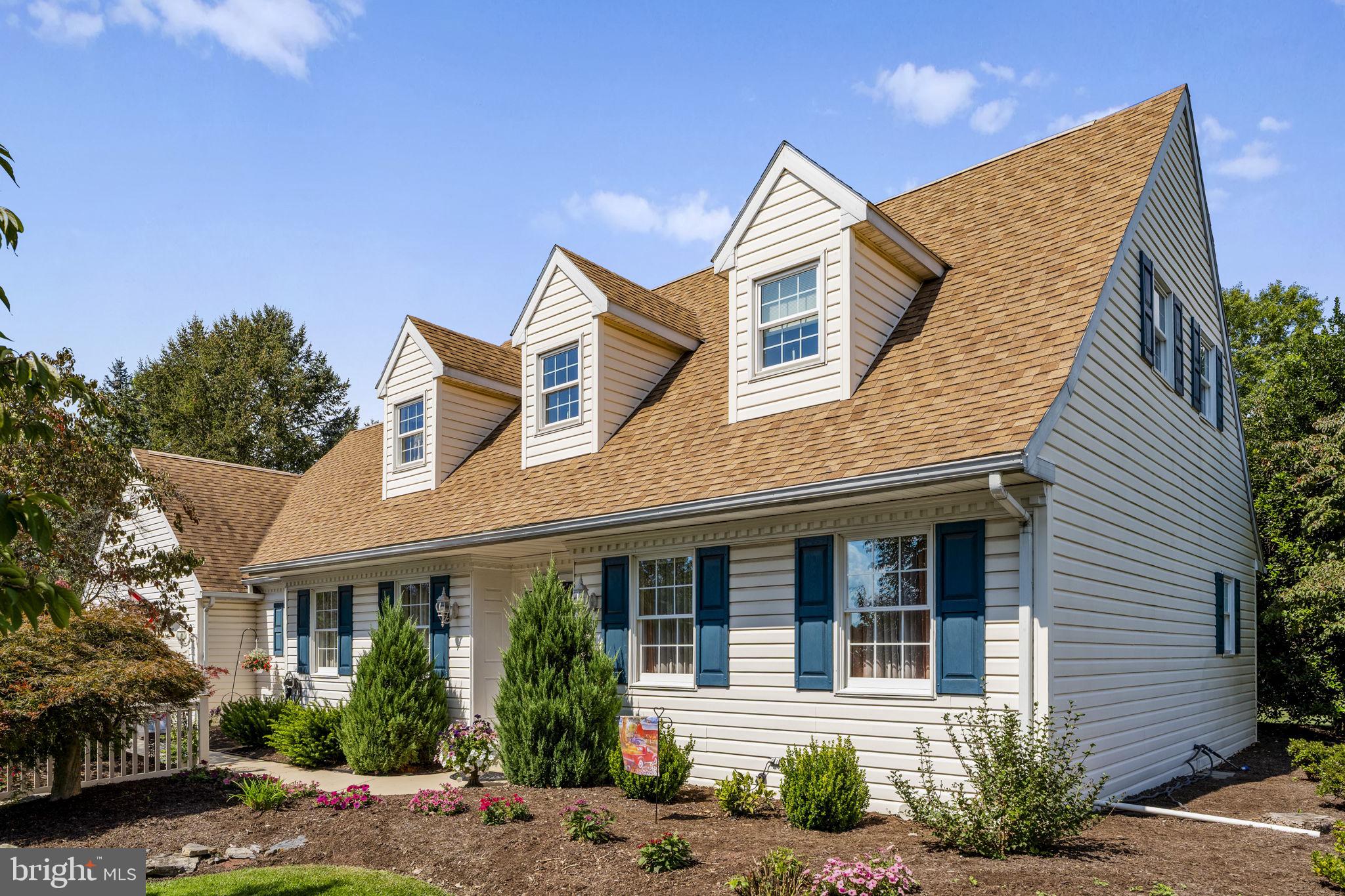 4 Eagle Circle Denver, PA 17517 - Photo 3 of 61 a view of a white house with large windows and a small yard
