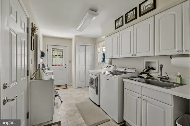 a bedroom with two beds and a couch