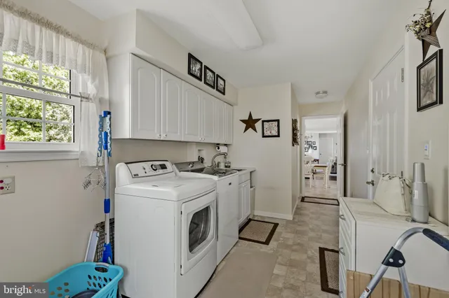 a living room with furniture and a book shelf