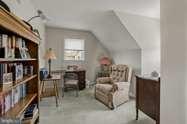 a bathroom with a shower curtain and a sink