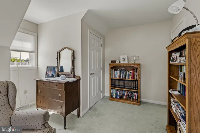 a view of walk in closet with clothes
