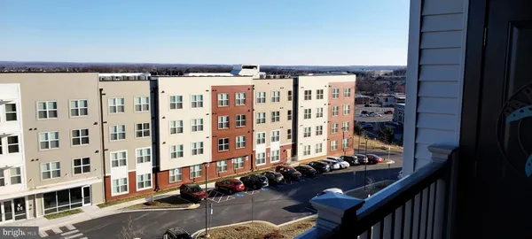 a spacious bathroom with a tub shower and a sink