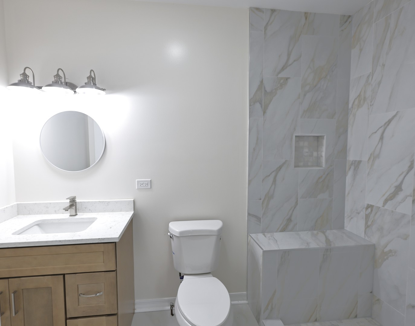 3621 South Winchester Avenue, Unit 1 Chicago, IL 60609 - Photo 11 of 24 a bathroom with a toilet sink and mirror