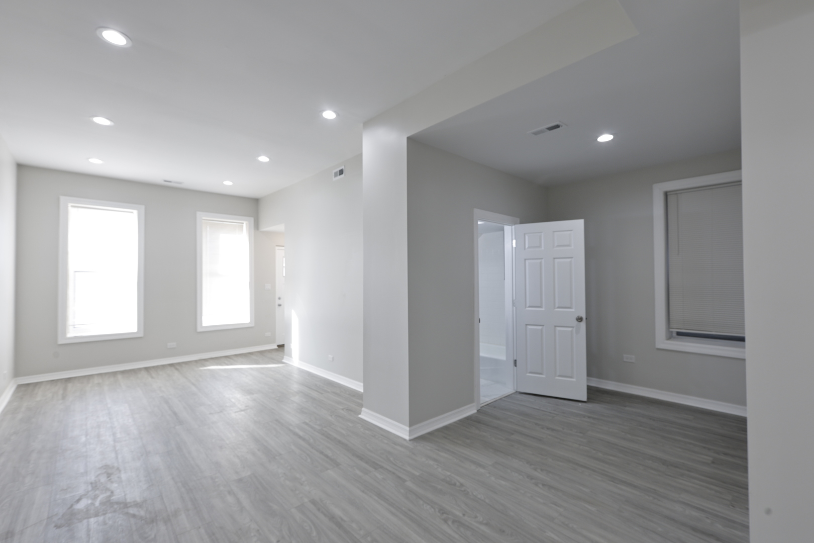 3621 South Winchester Avenue, Unit 1 Chicago, IL 60609 - Photo 2 of 24 a view of an empty room with wooden floor and a window