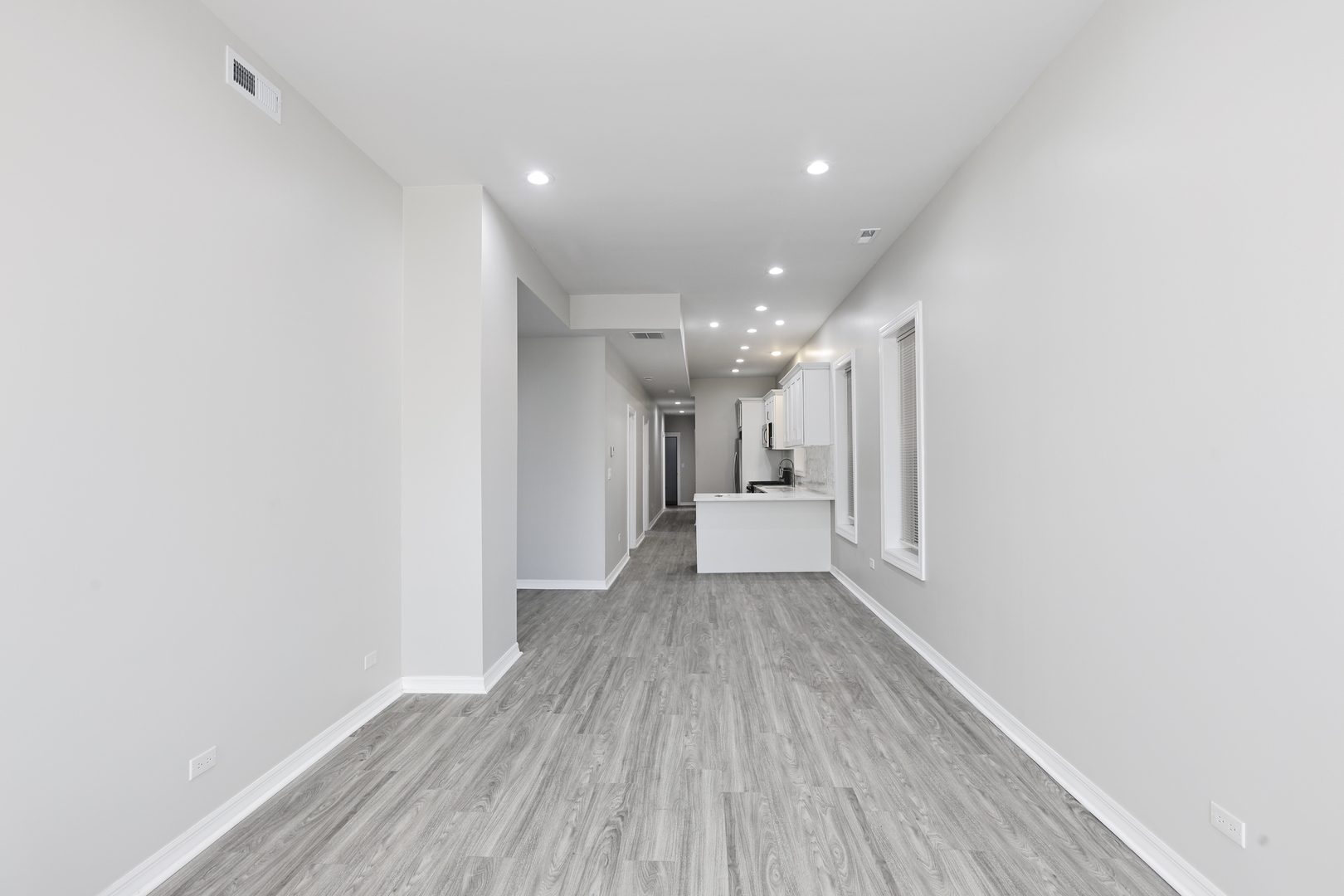 3621 South Winchester Avenue, Unit 1 Chicago, IL 60609 - Photo 3 of 24 a view of a hallway with wooden floor