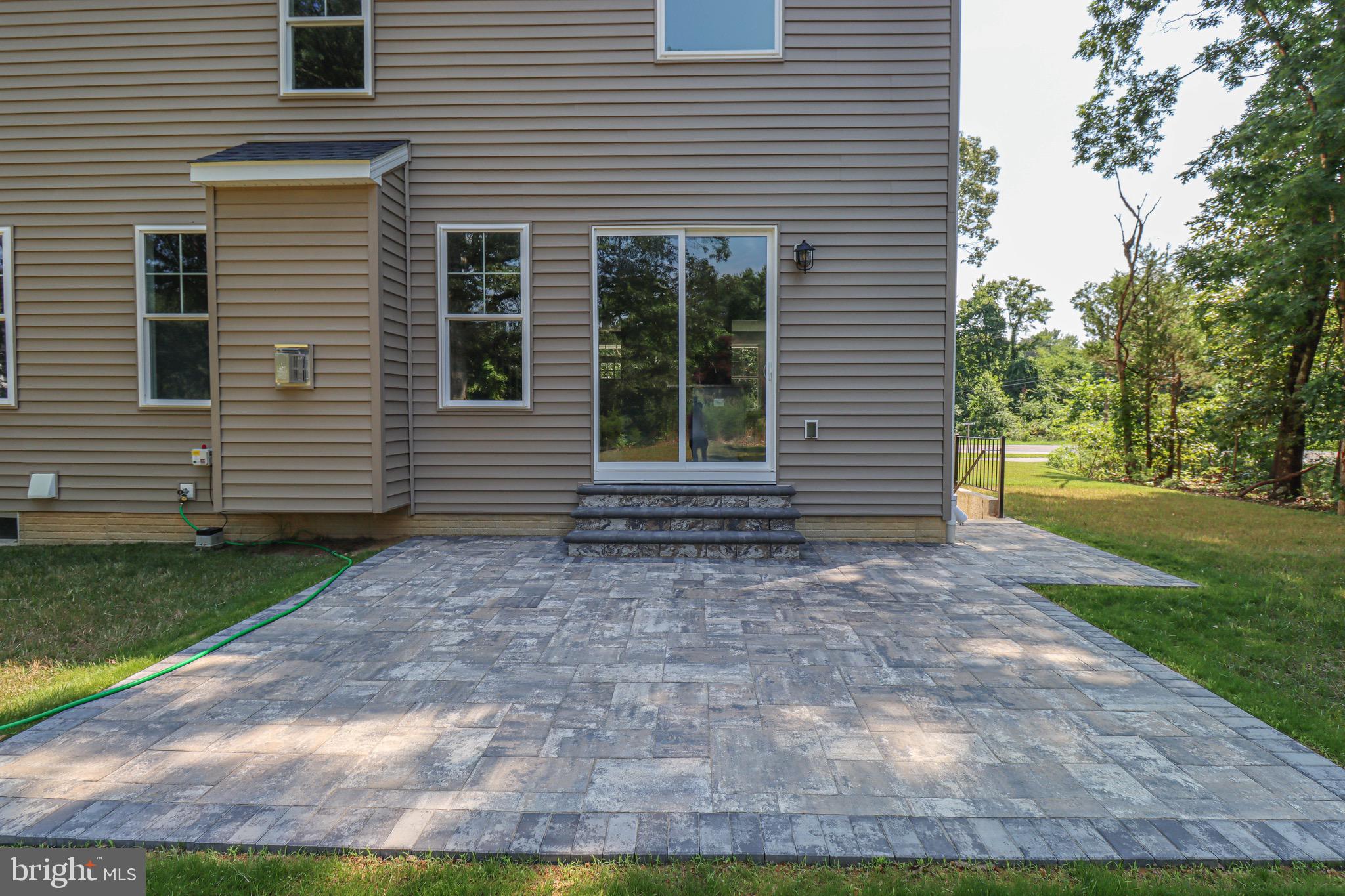 1305 Polyanski Drive Pasadena, MD 21122 - Photo 48 of 50 Paver Patio extending to Lower Level Entrance