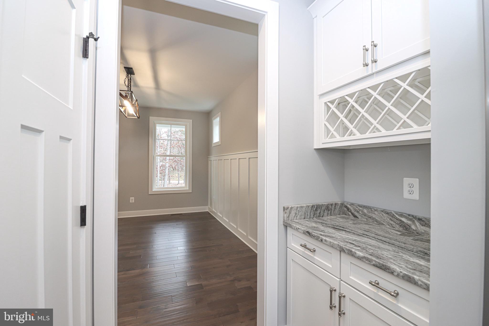 1305 Polyanski Drive Pasadena, MD 21122 - Photo 8 of 50 Butlers Pantry with wine rack