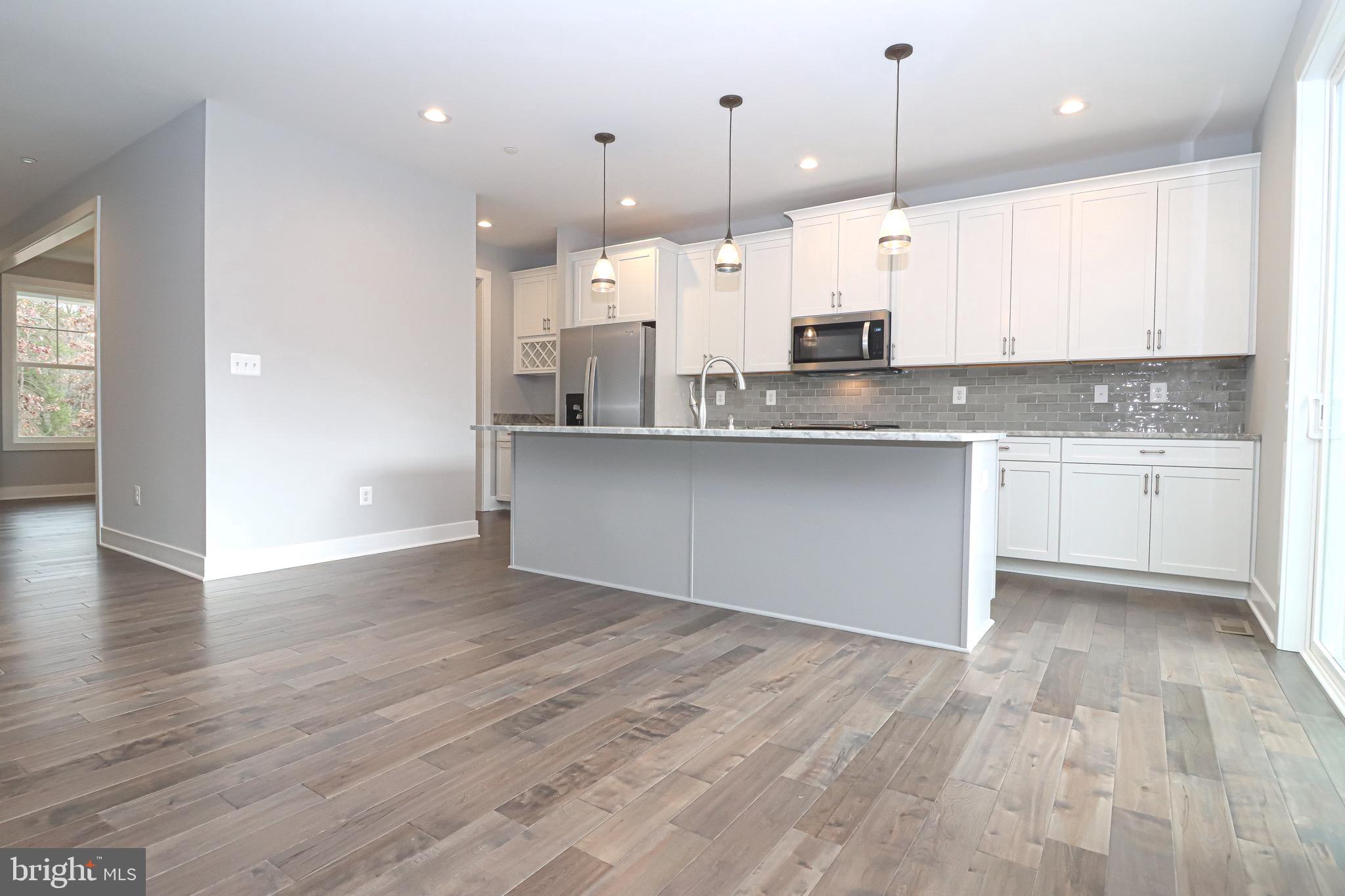 1305 Polyanski Drive Pasadena, MD 21122 - Photo 10 of 50 Kitchen Island, Granite Counter, Subway Backsplash