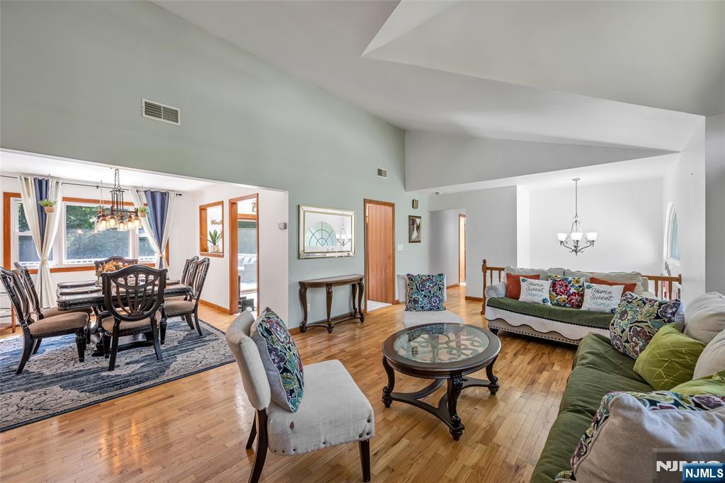21 Marcia Road Ringwood, NJ 07456 - Photo 8 of 42 a living room with furniture and a wooden floor