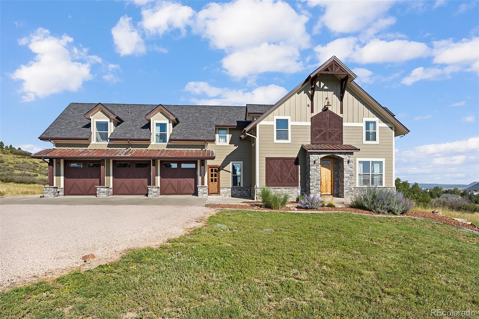 2135 Haystack Road Castle Rock, CO 80104 - Photo 1 of 35 a front view of a house with a yard