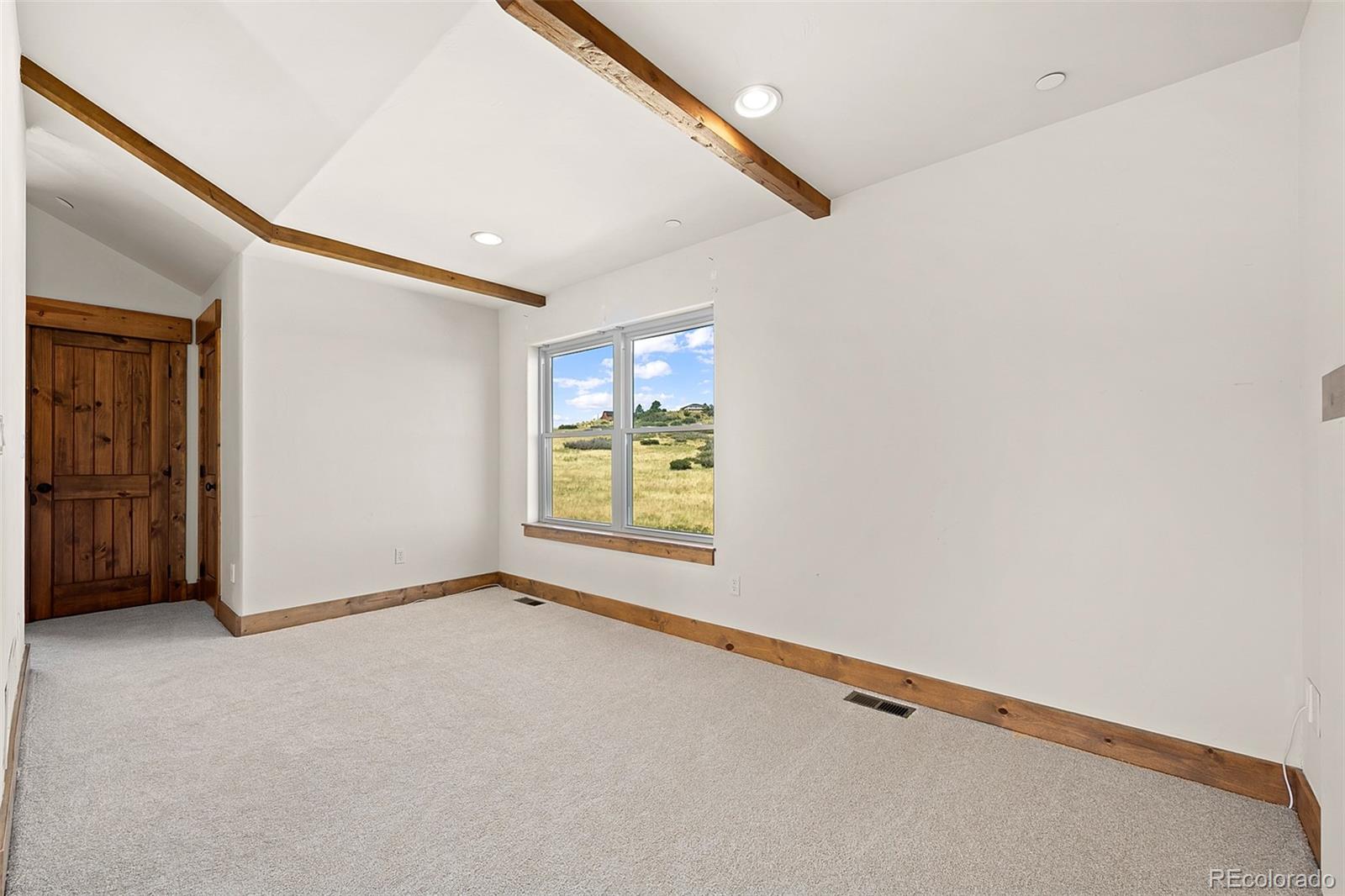 2135 Haystack Road Castle Rock, CO 80104 - Photo 18 of 35 a view of an empty room with a window