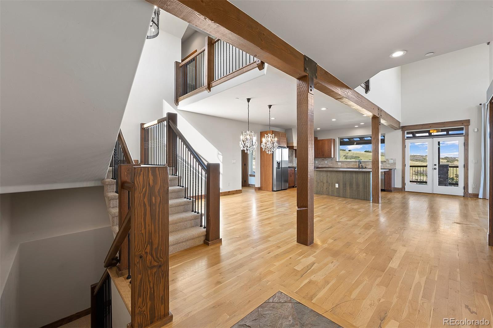 2135 Haystack Road Castle Rock, CO 80104 - Photo 4 of 35 a view of entryway and hall with wooden floor