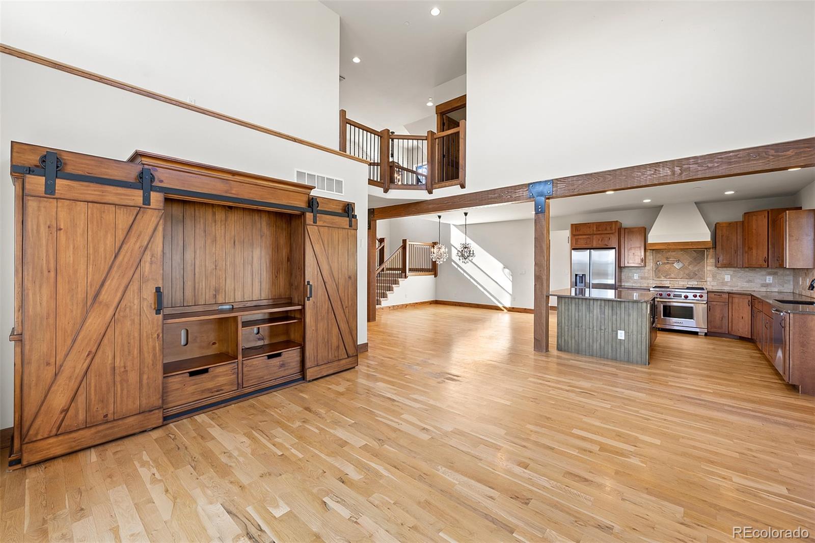 2135 Haystack Road Castle Rock, CO 80104 - Photo 8 of 35 a view of a room with wooden floor and stairs