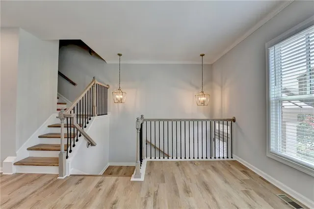 a kitchen with kitchen island granite countertop a sink appliances and cabinets