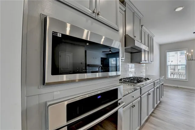 a view of livingroom with hardwood floor and a ceiling fan