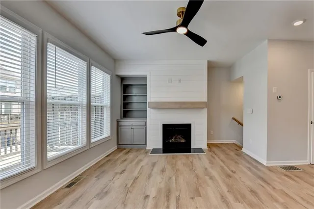a view of room with window and hardwood floor
