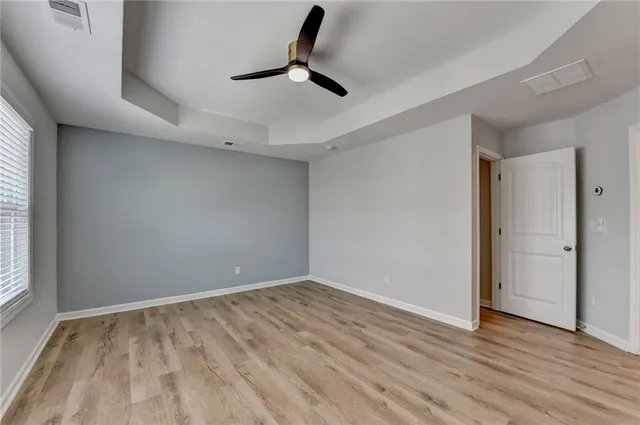 a bathroom with a bathtub sink and a mirror