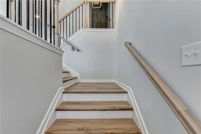 a view of a room with wooden floor