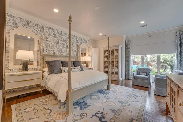 a bed room with a bed and a large window
