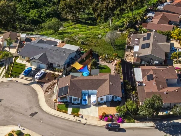 an aerial view of houses with yard