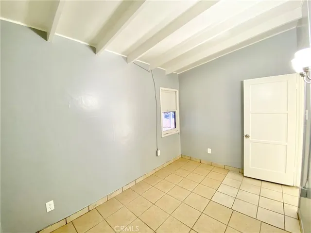 a view of a hallway to rooms