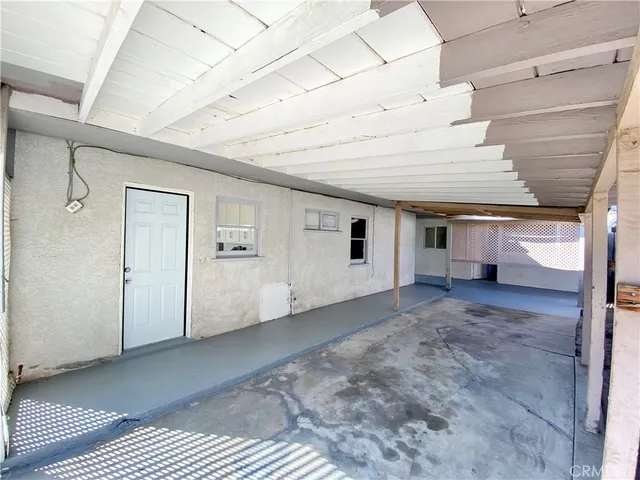 a view of an empty room and window