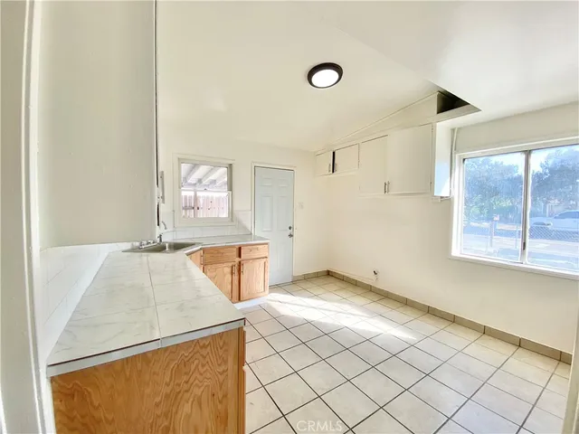 a bathroom with a toilet a sink a mirror a bathtub and shower