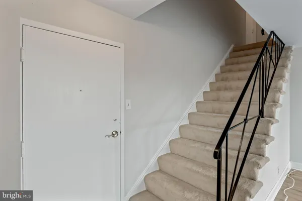 a view of entryway with wooden floor