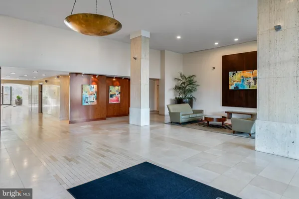 a view of a livingroom with furniture and a flat screen tv