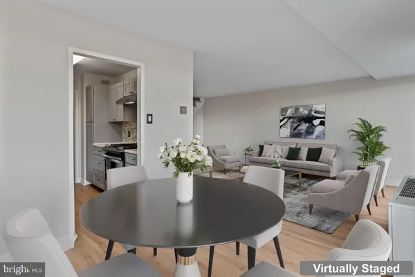 a dining room with furniture and wooden floor