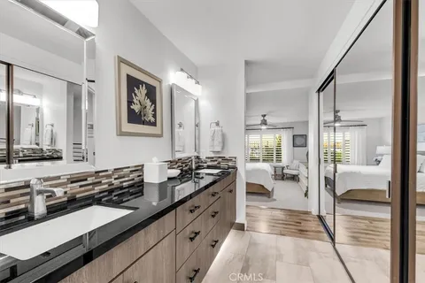 a large white kitchen with a large window
