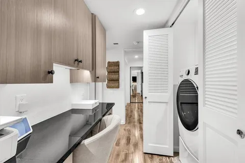 a close view of a kitchen with a sink and dishwasher