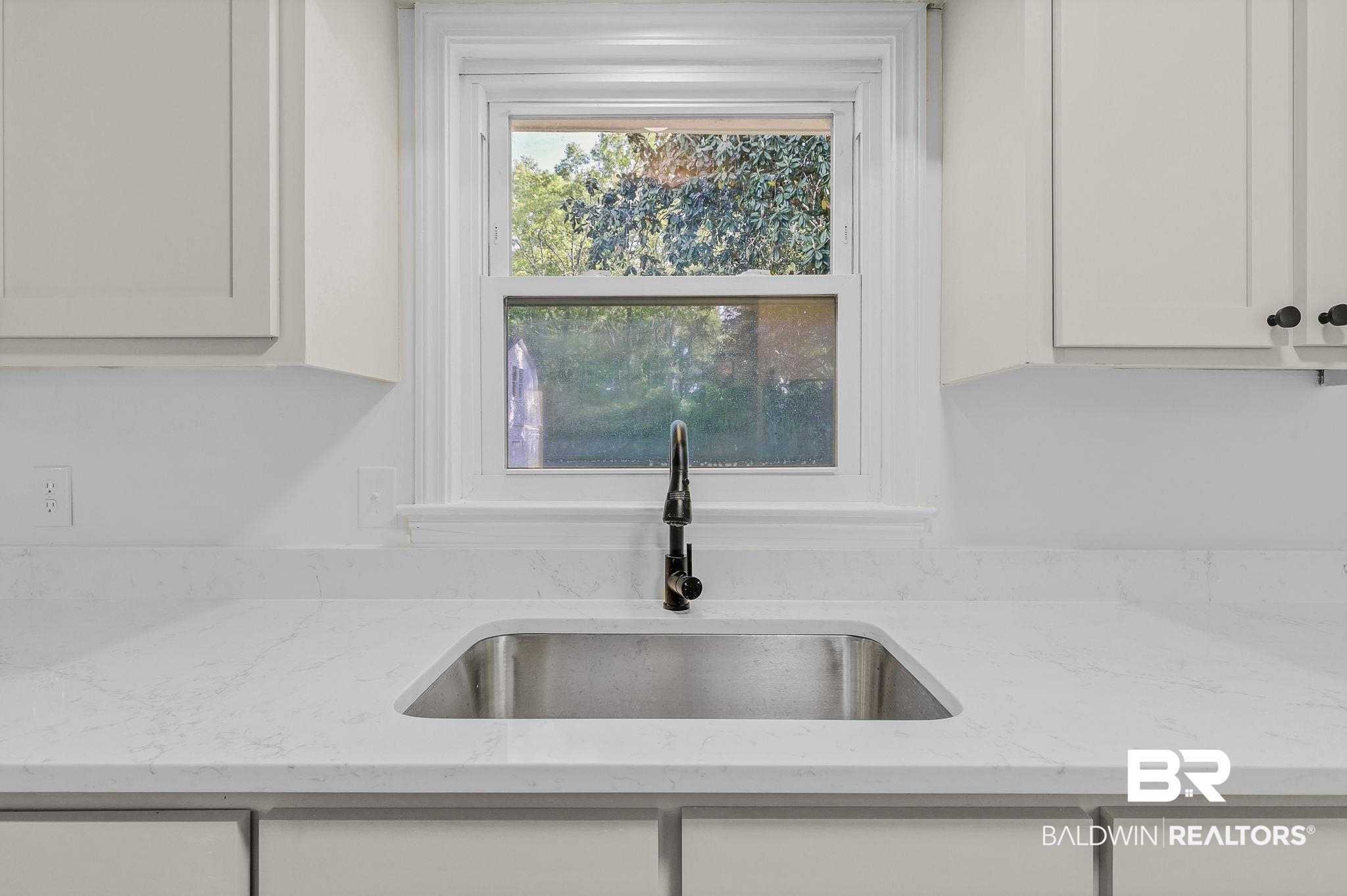 203 Anderson Road Saraland, AL 36571 - Photo 17 of 48 Details with light stone countertops, white cabinetry, and a sink