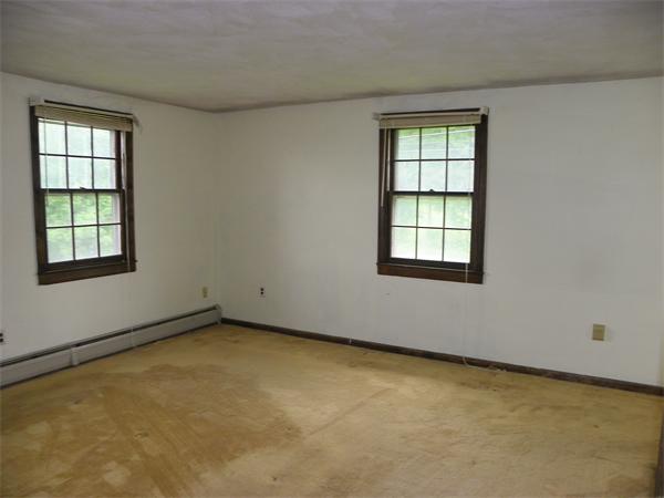 91 Nashua Road Pepperell, MA 01463 - Photo 12 of 14 an empty room with windows
