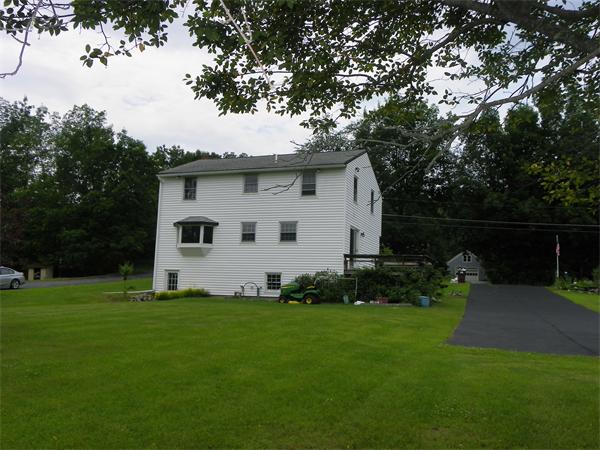 91 Nashua Road Pepperell, MA 01463 - Photo 14 of 14 a white house that has a tree in it
