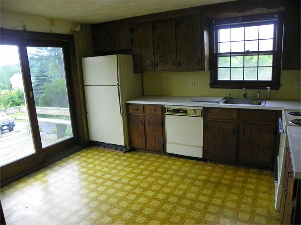 91 Nashua Road Pepperell, MA 01463 - Photo 5 of 14 a kitchen with stainless steel appliances granite countertop a refrigerator and a sink