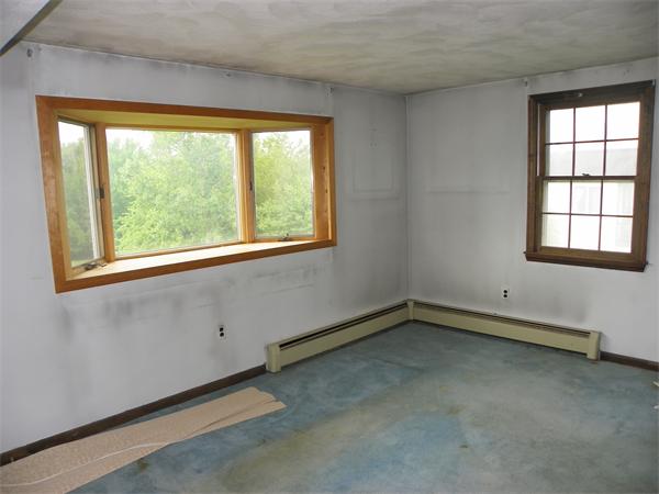 91 Nashua Road Pepperell, MA 01463 - Photo 8 of 14 an empty room with a window