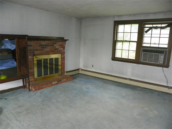 91 Nashua Road Pepperell, MA 01463 - Photo 9 of 14 an empty room with a fireplace