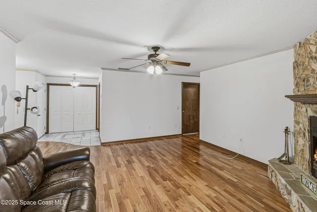 a bathroom with a granite countertop toilet sink and mirror