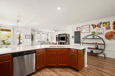 a kitchen with a sink a stove and cabinets