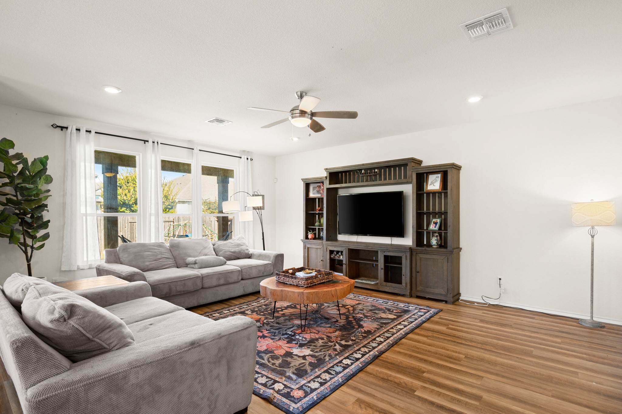 101 Kavanaugh Street Georgetown, TX 78628 - Photo 15 of 32 a living room with furniture and a flat screen tv