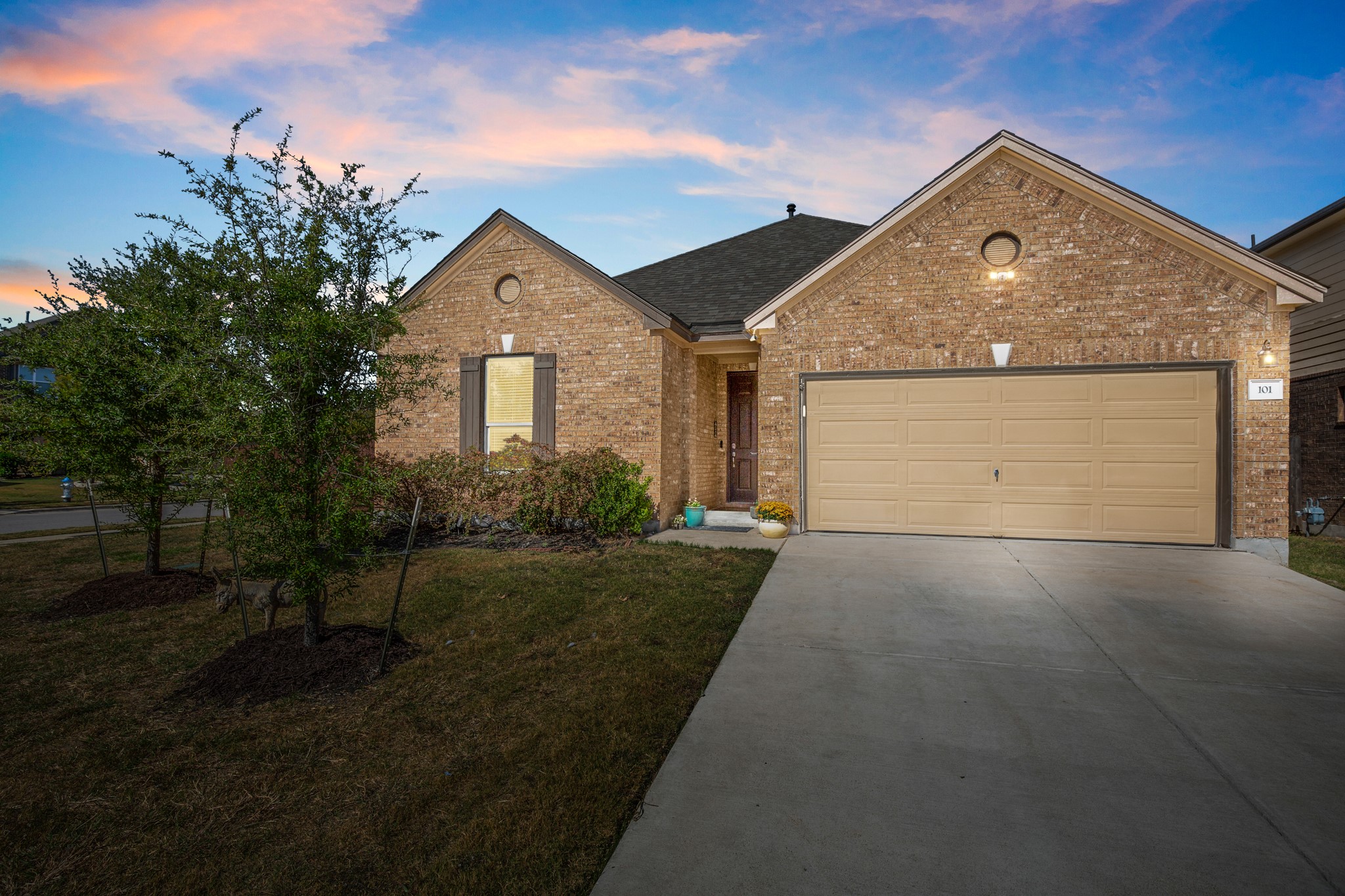 101 Kavanaugh Street Georgetown, TX 78628 - Photo 2 of 32 a front view of a house with a yard and garage
