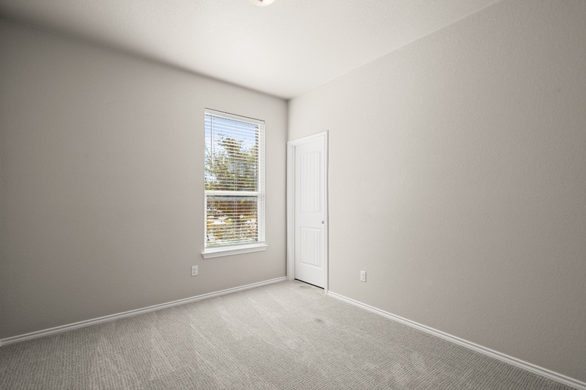 101 Kavanaugh Street Georgetown, TX 78628 - Photo 22 of 32 an empty room with windows